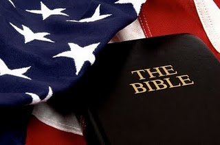 Holy Bible laying on top of American Flag