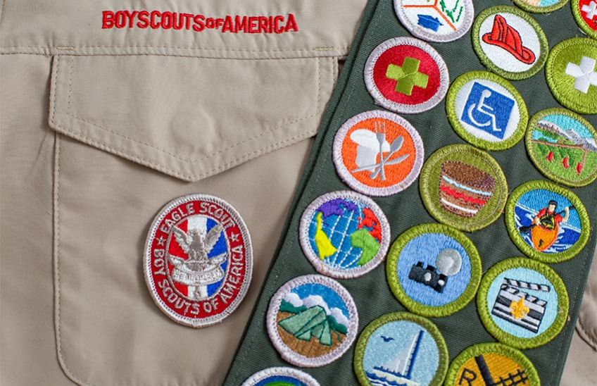 A Boy Scout Uniform with Merit Badges