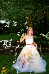 Bride covered in silly string at wedding