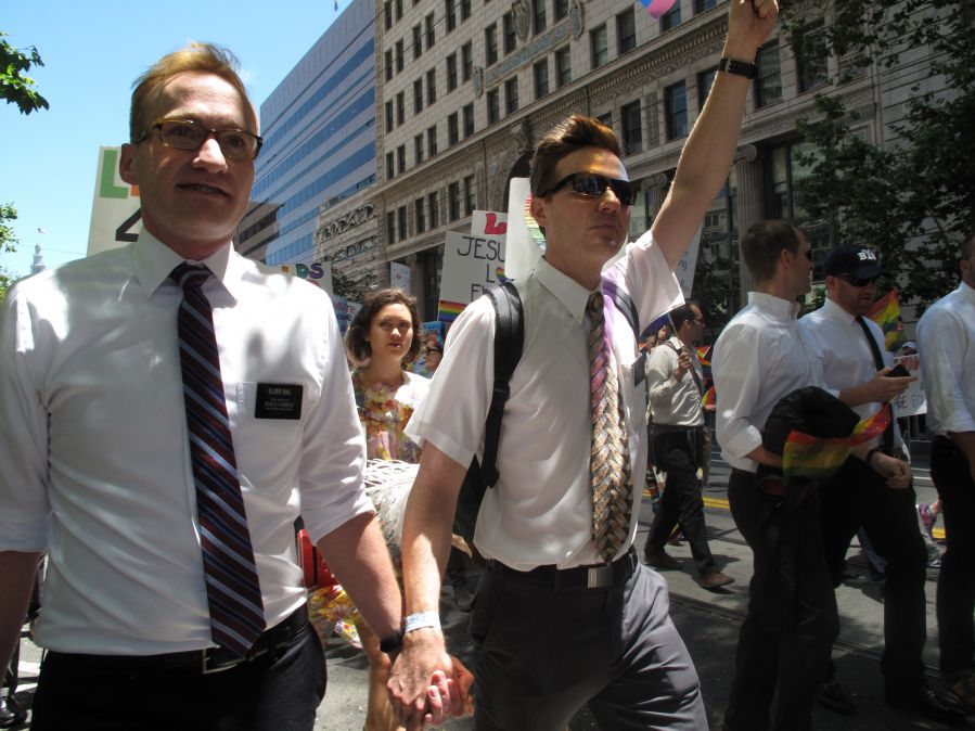 A pair of gay Mormons marching in a parade