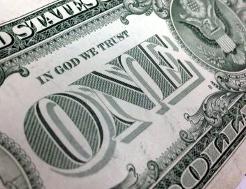 "In God We Trust" on dollar bill