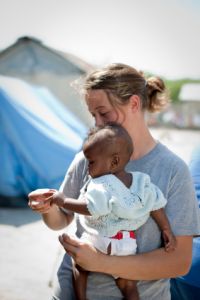 Haitian earthquake aid worker showing compassion