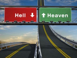 Highway signs showing path to heaven and hell