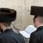 Hasidic jews wearing traditional shreitmel hat