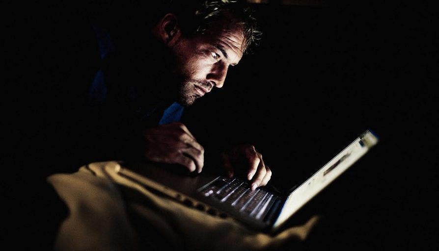 Man watching porn on his laptop