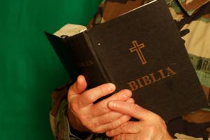 military chaplain holding bible
