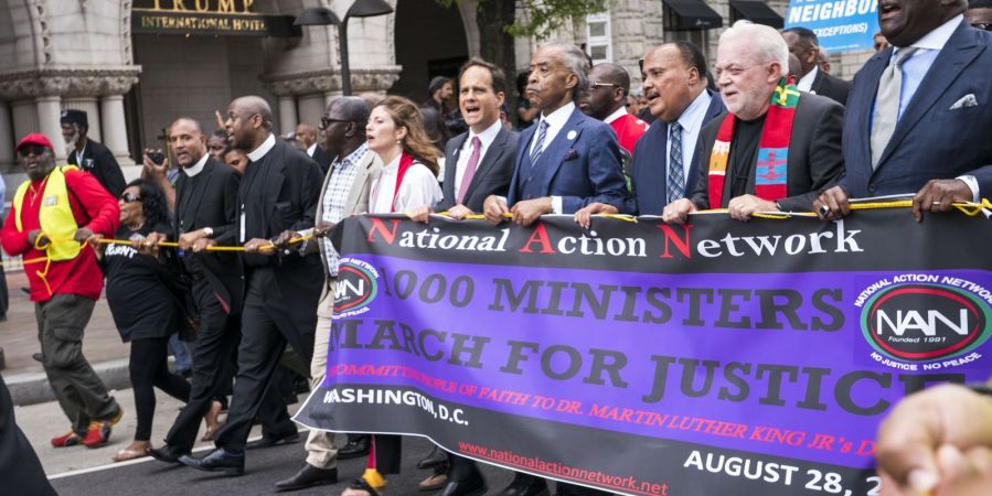 Al Sharpton leads fellow ministers in a march for justice.