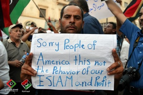 Libyans with signs, sorry people of America, this is not the behavior of our Islam and Prophet