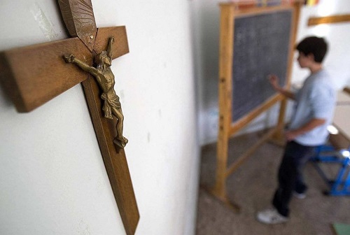 Christian cross in school classroom