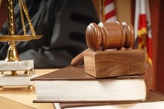 Gavel and legal books in court