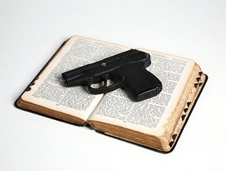 gun laying on open bible