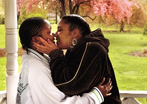 newlywed couple Tearese Bomar and Shamera Page sharing a kiss