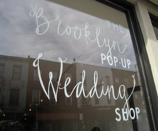 Window with Brooklyn Pop Up Wedding Shop written on it