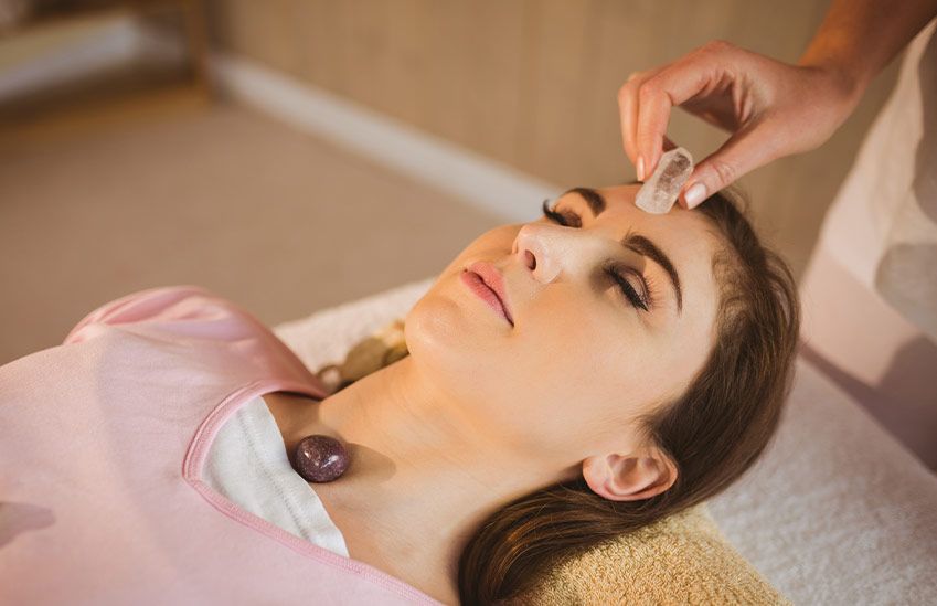 A Woman at a Crystal Healing Session