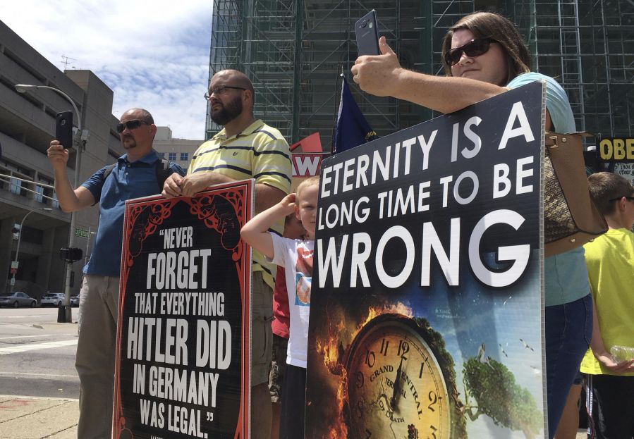 Anti-abortion protesters in Kentucky display signs. 