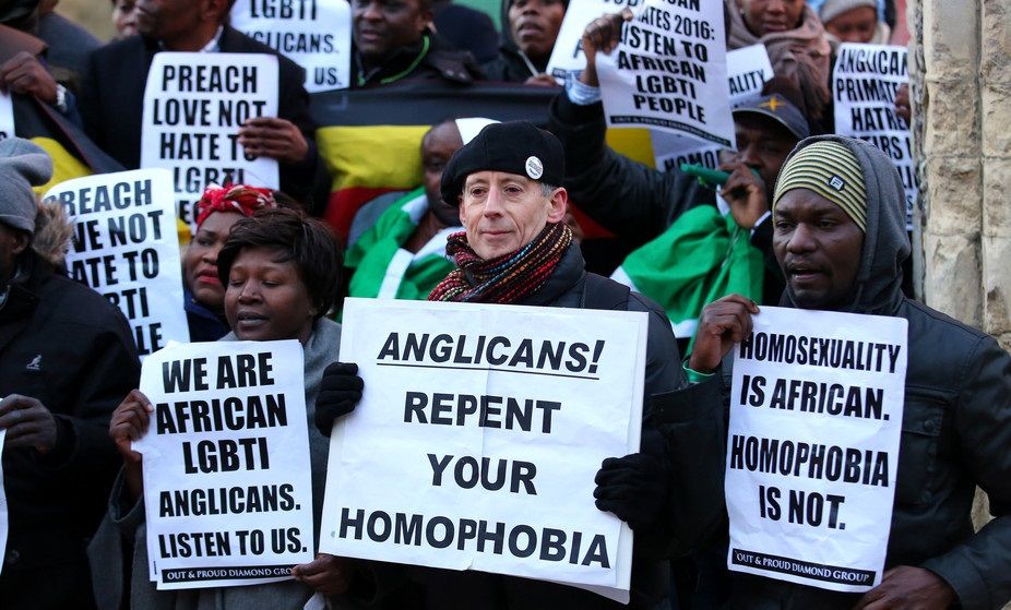 A pro-LGBT group protests the Anglican Church