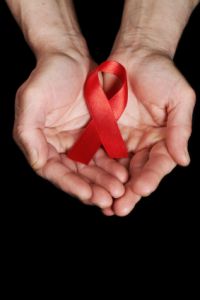 hands holding AIDS  awareness ribbon