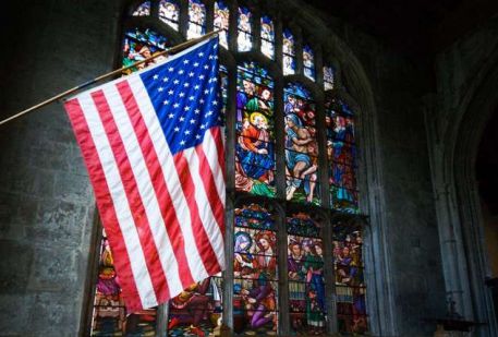 An American flag hanging in a church