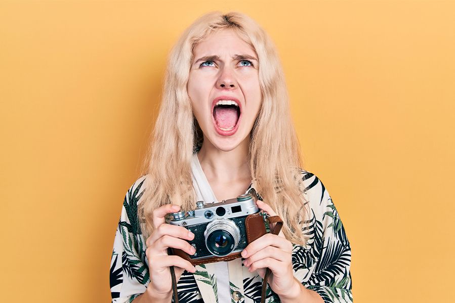 a female wedding photographer screaming in anger