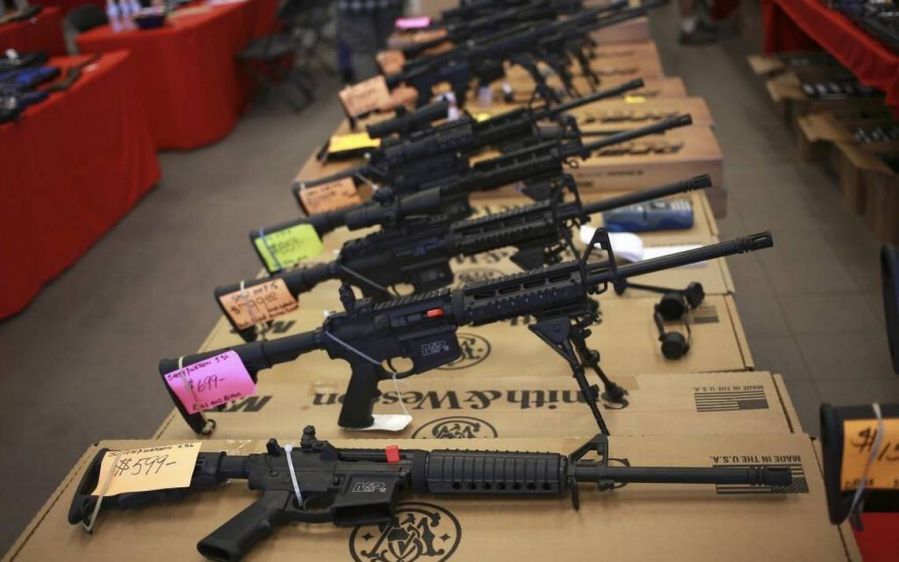 Assault rifles lined up in a store