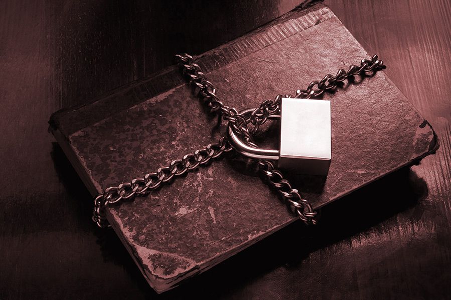 banned book with lock and chain
