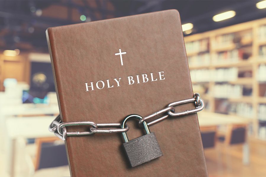 bible wrapped in padlock and chains in school library