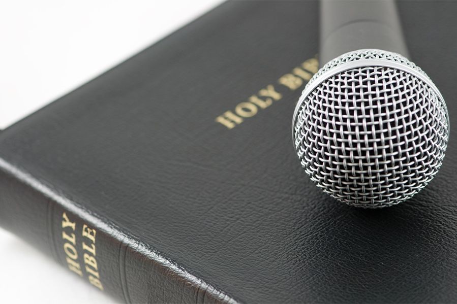microphone laying atop bible