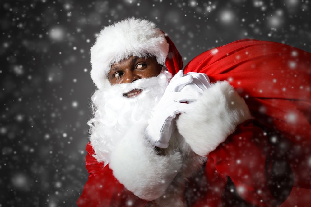 black santa carrying presents