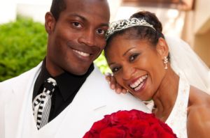 wedding couple posing and smiling