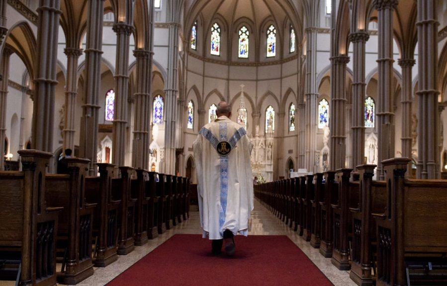 Catholic Priest in church