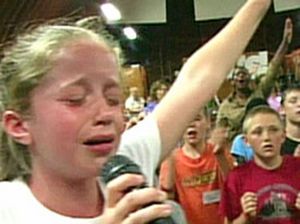 Child praising God at Jesus Camp