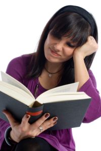 woman reading Bible against white background