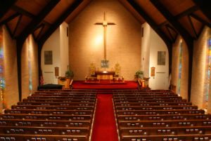 Christian church interior filled with empty pews