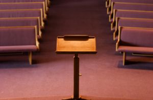 church pulpit with empty pews