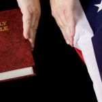person separating bible and american flag