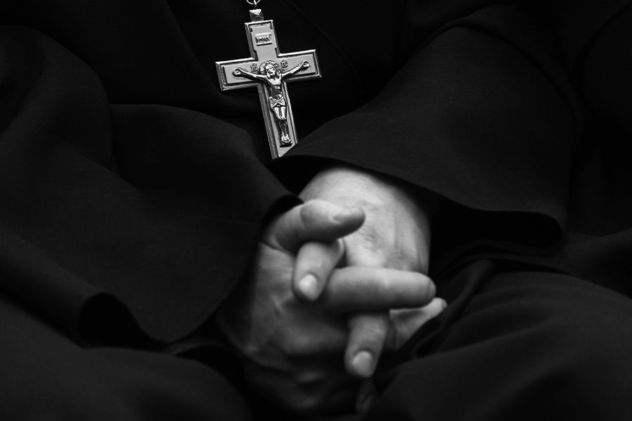 priest hands in black and white