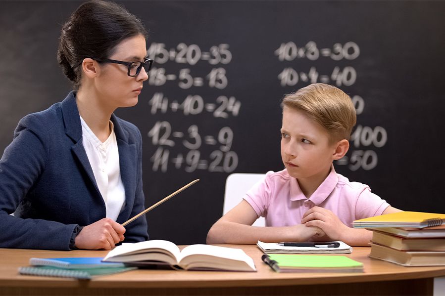 teacher threatening corporal punishment with ruler to child