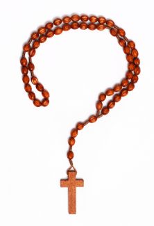 A Christian cross necklace in the shape of a question mark.