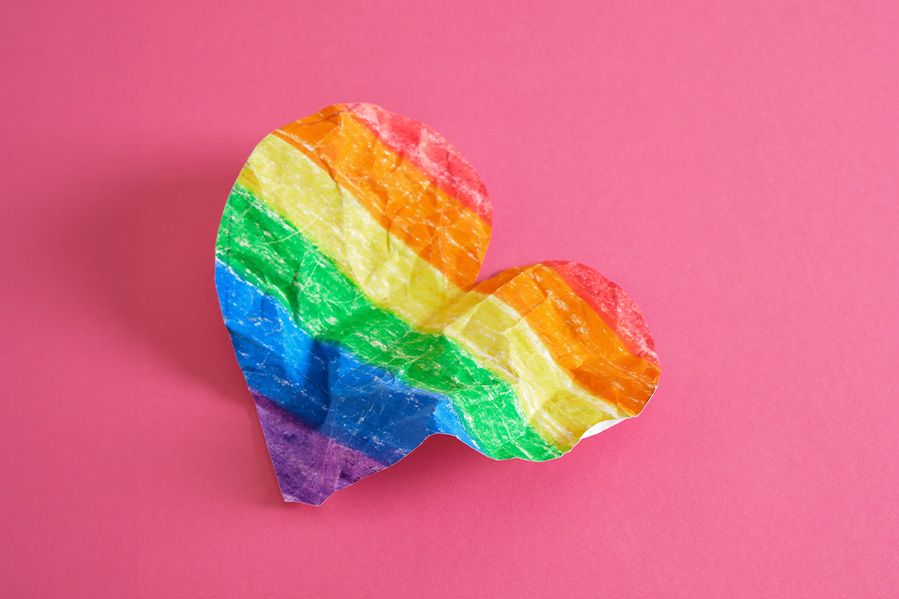 rainbow paper heart crumpled up, depiction of religious trauma on lgbtq community