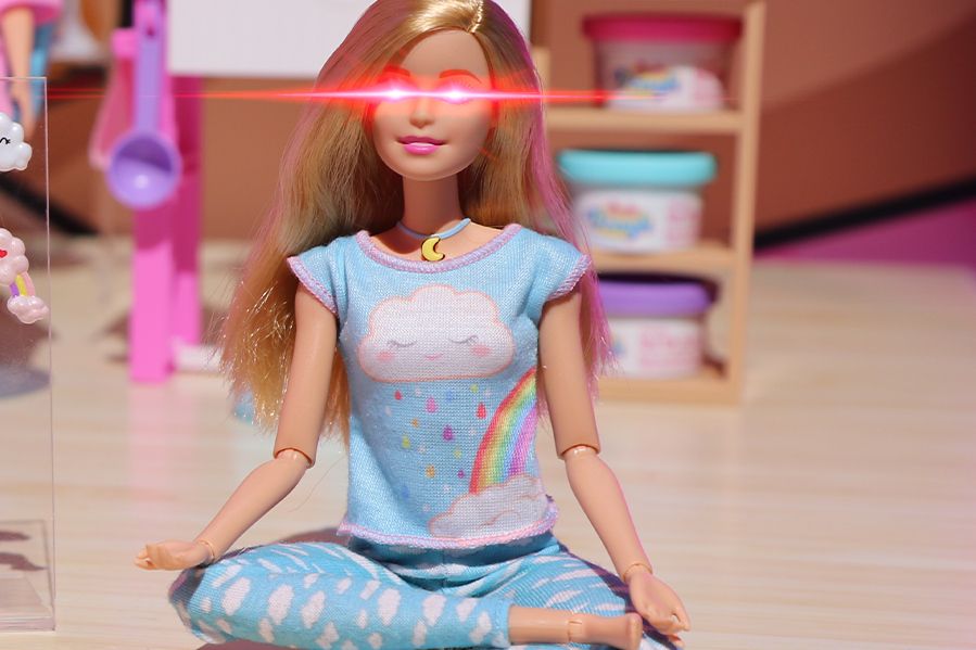 yoga Barbie toy with demonic eyes