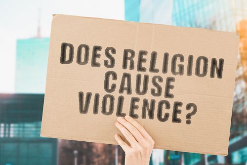 A cardboard sign held by a lone hand asks the question:
