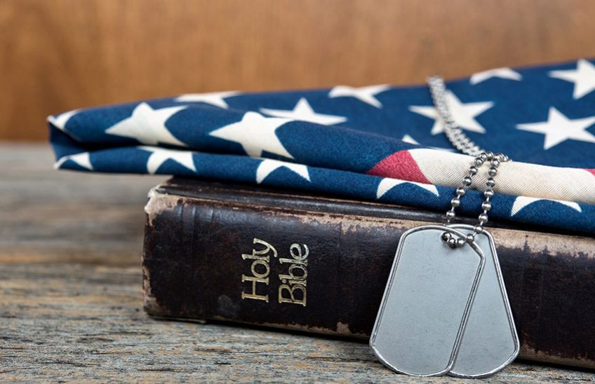 Dog tags resting on the Holy Bible