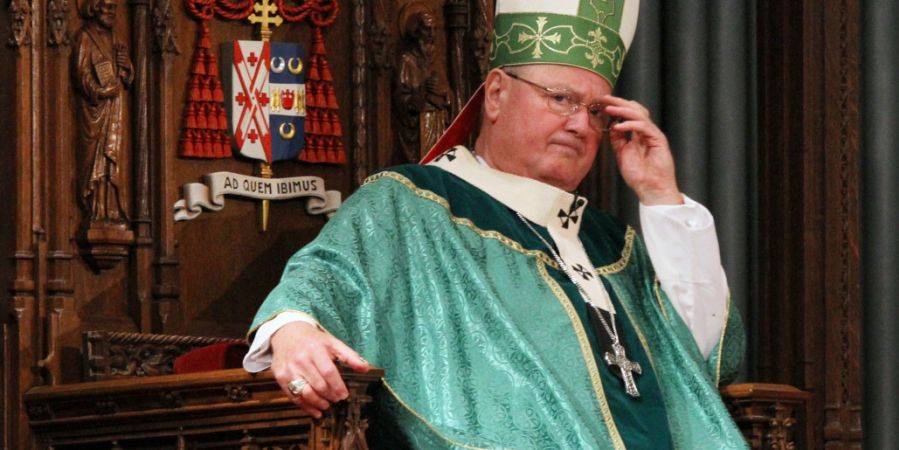 Cardinal Timothy Dolan looking upset.