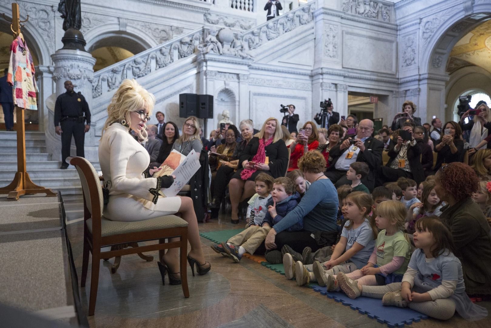 Dolly Parton reads to a group of children at a Library of Congress event
