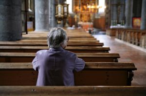 woman sitting alone in church