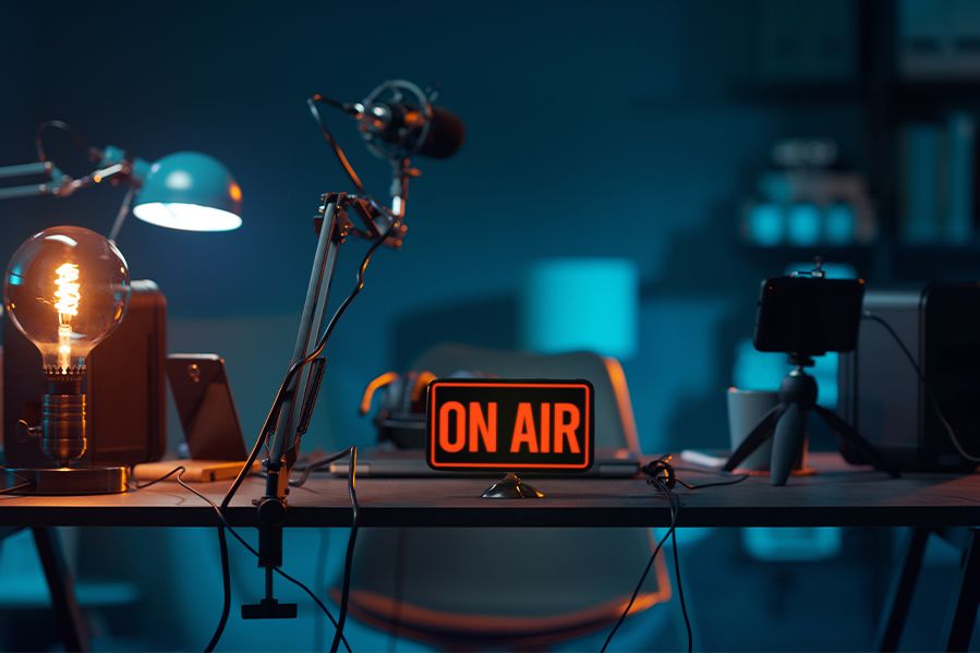 empty radio dj booth with on air sign lit up