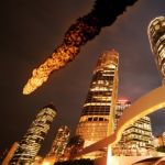 Flaming comet shooting across city skyline