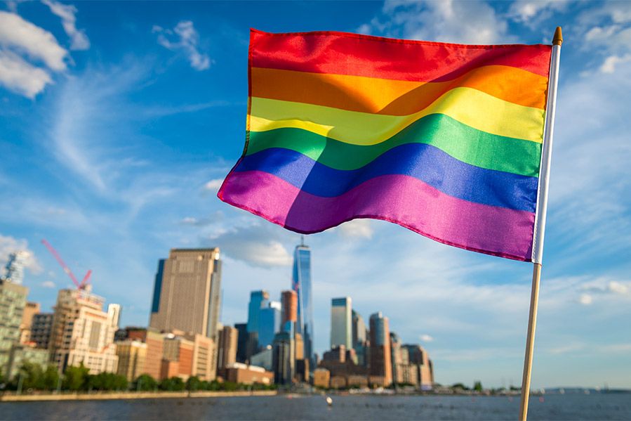 Gay pride flag against NYC skyline