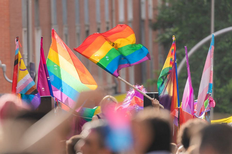 flags waving at gay pride parade