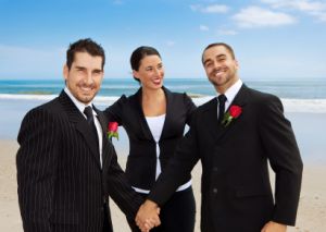 two grooms holding hands at wedding